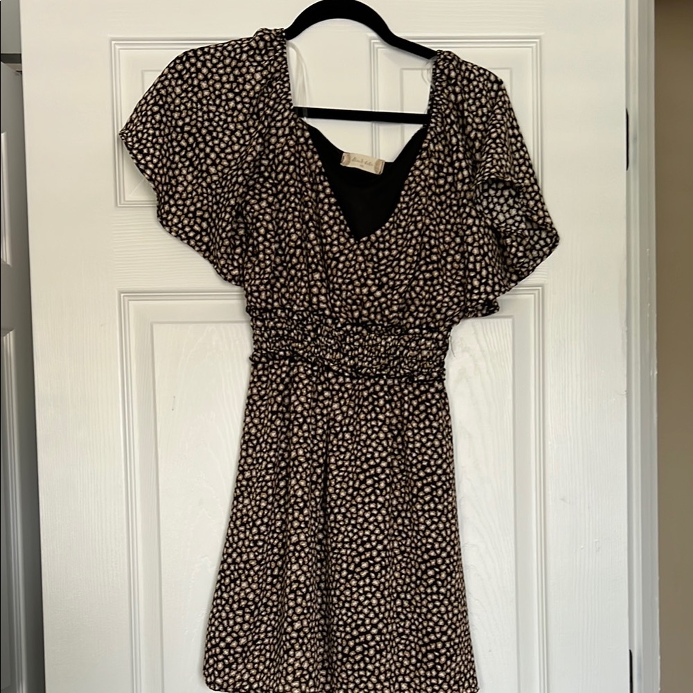 Elegant Black, White, and Tan Polka Dot Dress